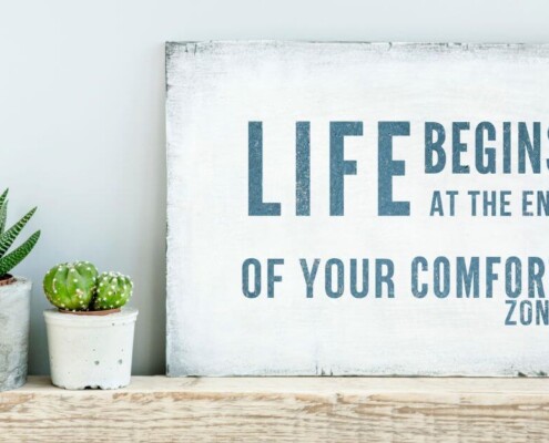 Crafty sign that says life begins at the end of your comfort zone