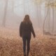 A woman walking alone in foggy woods. We offer young adult therapy in Medford, NJ & Cherry Hill. Start working with a therapist today!
