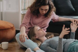 Mom with teen daughter on the couch