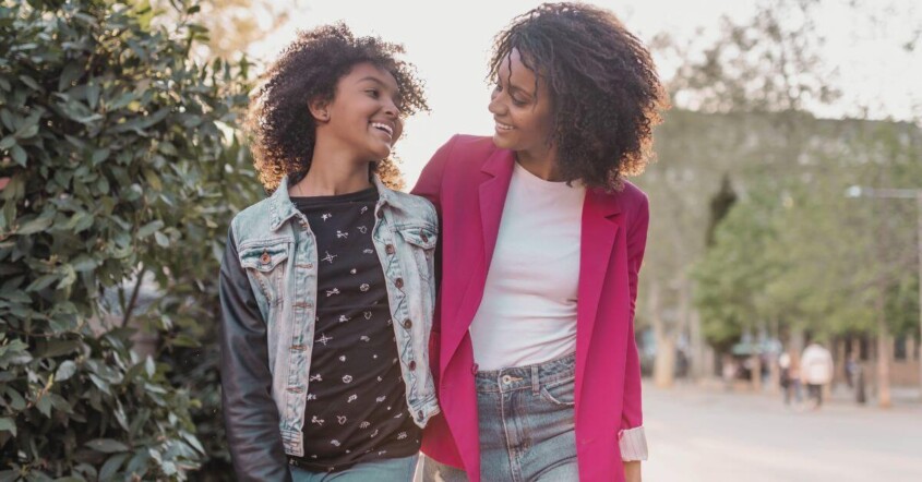 A mother & daughter walking side-by-side to school. Representing how teen therapy in Medford, NJ is here to support your teen this upcoming school year. Get them the personalized support they deserve!
