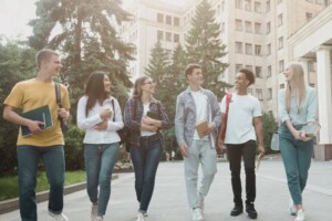 Softly lit images of diverse students walking on a college campus.