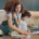 A mom multitasking during the morning routine with child.