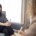 A woman talks with a therapist during a counseling session in a calm, modern therapy office