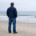 Man standing alone at with his hands in pocket, isolated. This represents men's depression & how therapy for men in Medford, NJ can help. Find support & connection today.